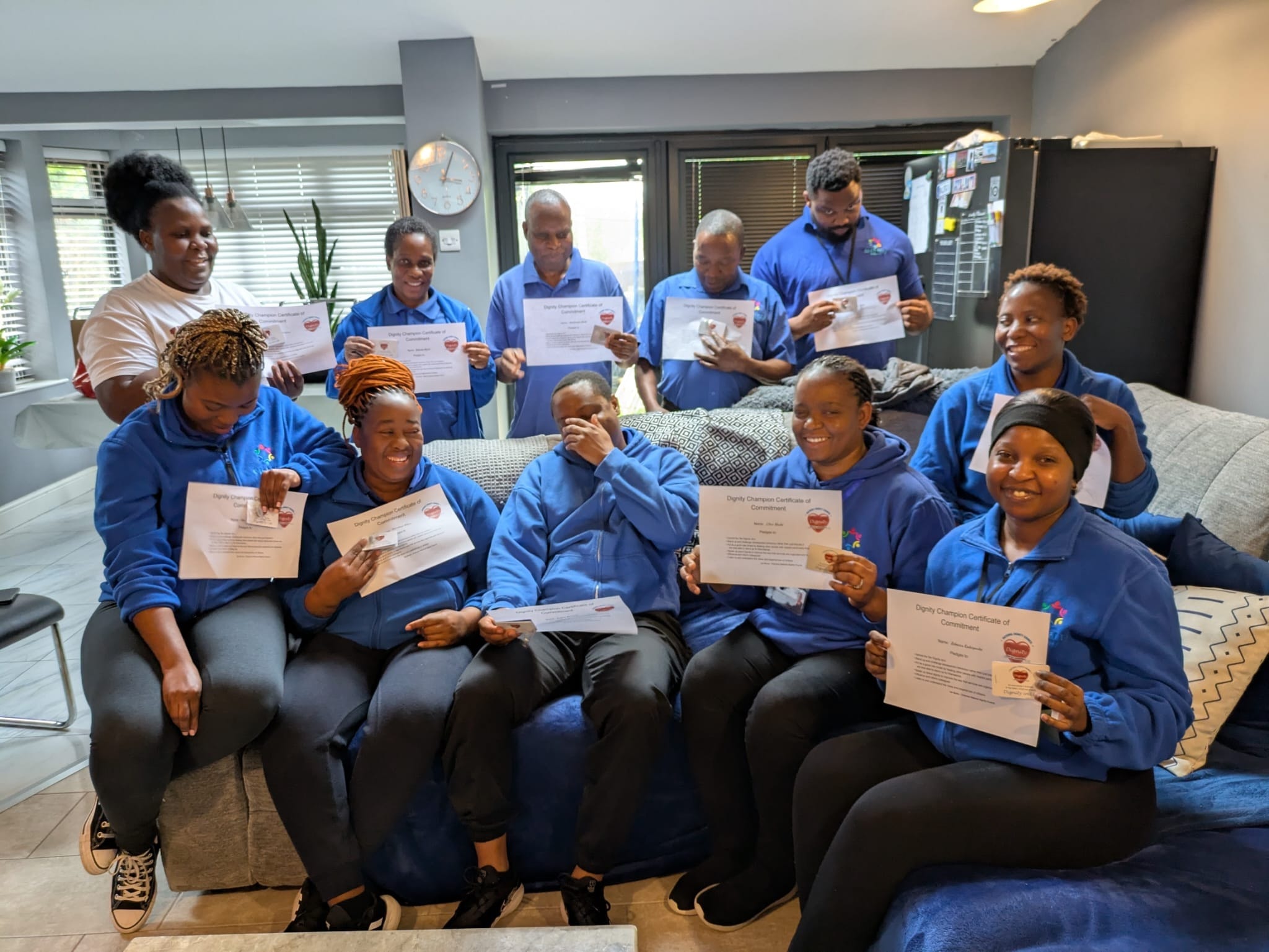Gleberry Support team with Dignity Champion certificates